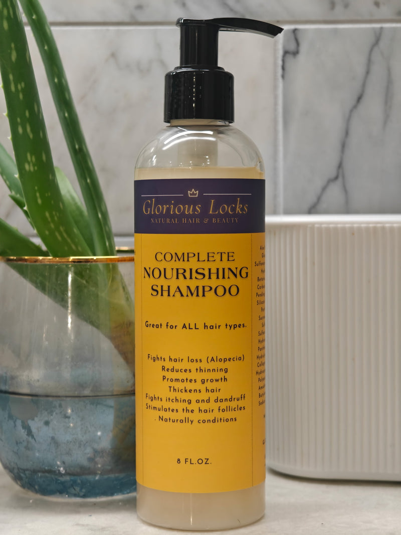 Glorious Locks Complete Nourishing Shampoo 8oz pump bottle with purple and gold label displayed next to aloe vera plant